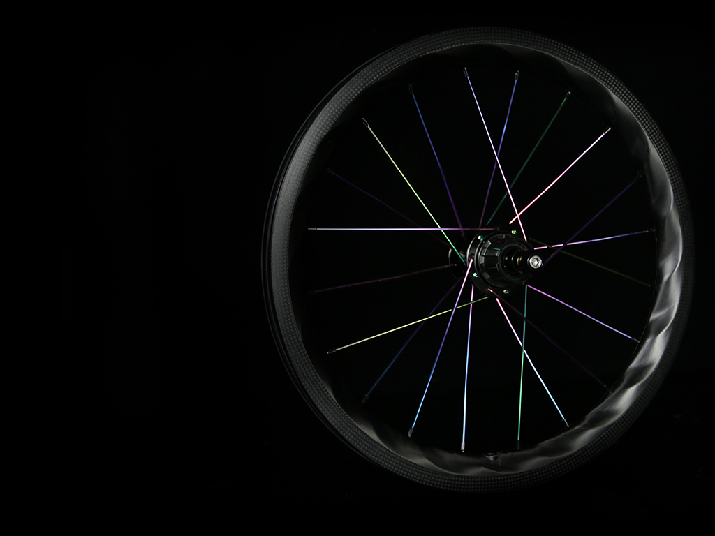 PADH-Lightbicycle-brompton-rims-laced-with-oil-slick-spokes.jpeg