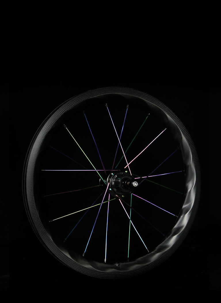 PADS-Lightbicycle-brompton-rims-laced-with-oil-slick-spokes.jpeg